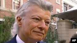 In this June 5, 1995, frame grab taken from video, Robert James Waller is interviewed at the “Bridges of Madison County” film premiere, in Los Angeles.