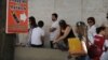 FILE - People line up outside the U.S. Consulate to get visas in Rio de Janeiro, Brazil, Jan. 5, 2012. 