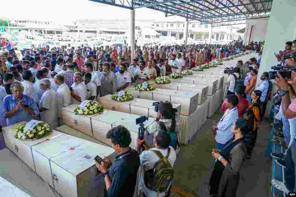 Relatives mourn near the deceased after the coffins arrive on an Indian Air Force plane from Kuwait at the Cochin International Airport in Kochi, India.&nbsp;Grieving families kept a solemn vigil in the terminal of an Indian airport as the bodies of dozens of migrant workers killed in a Kuwait building fire returned home.&nbsp;