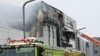 Firefighters work to extinguish a fire at a lithium battery factory in Hwaseong, South Korea, June 24, 2024. 