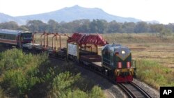 FILE - A train moves in the vicinity of a cross-border rail link between North Korea and Russia, near Tumangang, North Korea, Oct. 4, 2008.