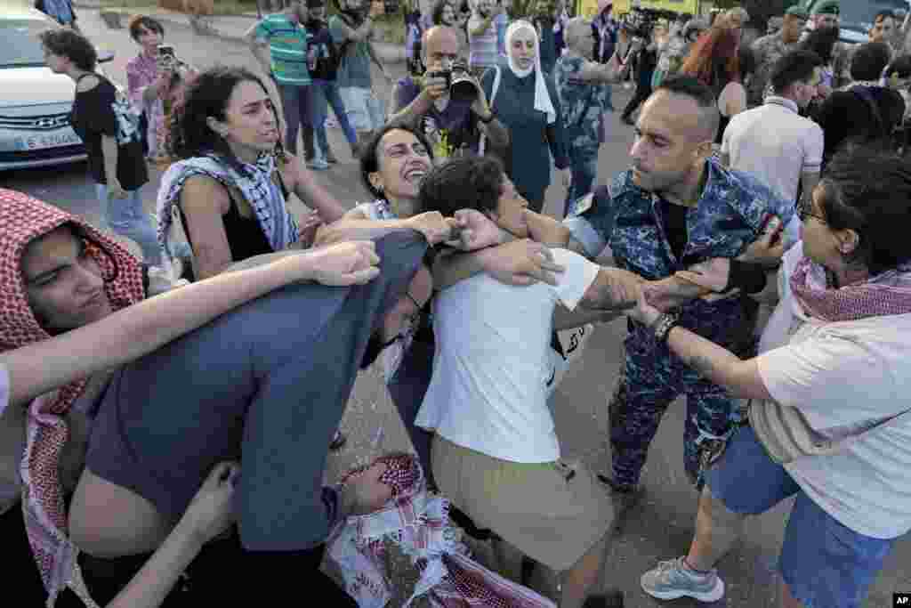 Protesters clash with riot police during a demonstration near the Egyptian embassy in Beirut, Lebanon, in solidarity with the Palestinian people in Gaza and demanding the Egyptian authorities open the Rafah border crossing between Egypt and the Gaza Strip.&nbsp;