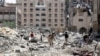 Palestinians inspect damage in Qatari-funded Hamad City following an Israeli raid in Khan Younis in the southern Gaza Strip, Aug. 24, 2024.