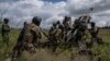 FILE - Ukrainian servicemen prepare to fire at Russian positions from a U.S.-supplied M777 howitzer in Kharkiv, Ukraine, on July 14, 2022. VOA has learned the U.S. will provide up to $150 million in additional military aid for Ukraine as soon as Oct. 25, 2023.