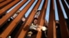 Migrants wait for asylum hearings at the US-Mexico border on May 11, 2023, as seen from San Ysidro, California. COVID rules that have prevented hundreds of thousands from claiming asylum expired, creating uncertainty for migrants.