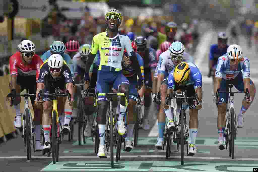 Eritrea&#39;s Biniam Girmay celebrates as he crosses the finish line during the third stage of the Tour de France cycling race over 230.8 kilometers (143.4 miles) with start in Piacenza and finish in Turin, Italy.