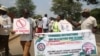 FILE - Zimbabweans protest against sanctions imposed on their leaders outside the U.S. Embassy in Harare in October 2022. It may soon be a crime if any Zimbabwean attends a meeting calling for sanctions against the nation. (Columbus Mavhunga/VOA)