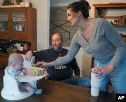 FILE - Mike and Jane Roberts tend to their son, Dennis, at their Pocatello, Idaho, home on March 1, 2024.