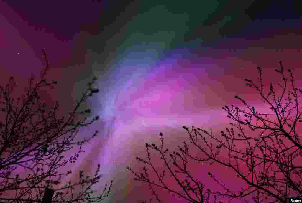 The aurora borealis, also known as the &#39;northern lights,&rsquo; caused by a coronal mass ejection on the Sun, illuminate the skies over the southwestern Siberian town of Tara, Omsk region, Russia, May 11, 2024.&nbsp;