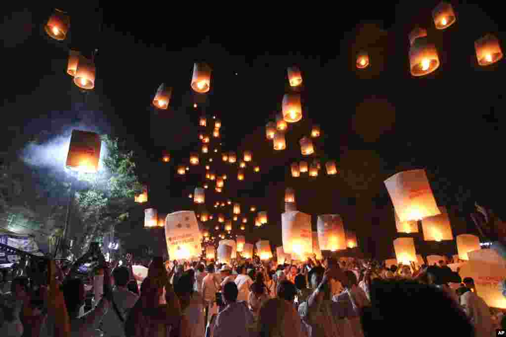 People release lanterns during the celebration of Vesak, which marks the day of Buddha&#39;s birth, death and enlightenment at the 9th century Borobudur Temple in Magelang, Central Java, Indonesia.