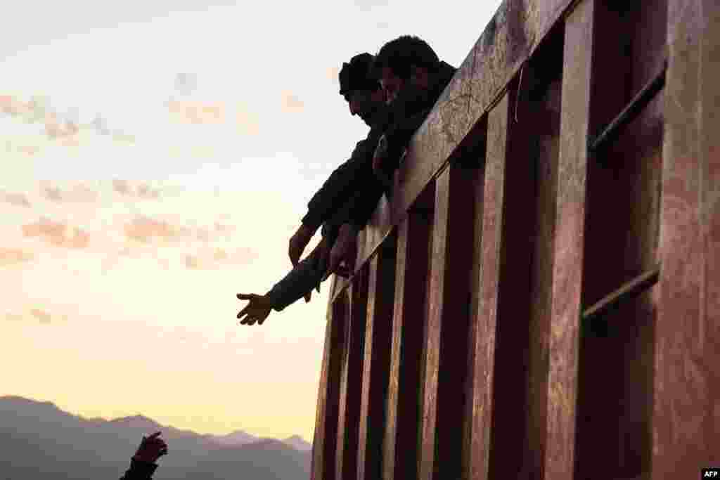 Refugees stand in the back of a truck after crossing the border near Kornidzor.&nbsp;More than 65,000 Armenians have fled Nagorno-Karabakh for Armenia, as the exodus continued from the breakaway enclave which Azerbaijan recaptured last week in a lighting offensive.&nbsp;