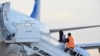 Venezuelan migrants board a plane in Harlingen, Texas, Oct. 18, 2023. One hundred thirty-five migrants were deported from the U.S. to Caracas, Venezuela. 