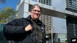 David Moser, an American and associate professor at Capital Normal University in Beijing, poses for a photo at the university, March 22, 2024, in Beijing.