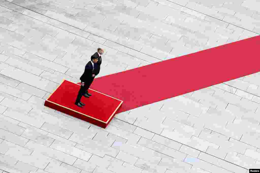 German Chancellor Olaf Scholz and British Prime Minister Rishi Sunak attend a military honors ceremony at the Chancellery in Berlin, Germany.