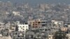 A picture taken from a position in southern Israel on March 6, 2024 shows destroyed buildings in the Gaza Strip.