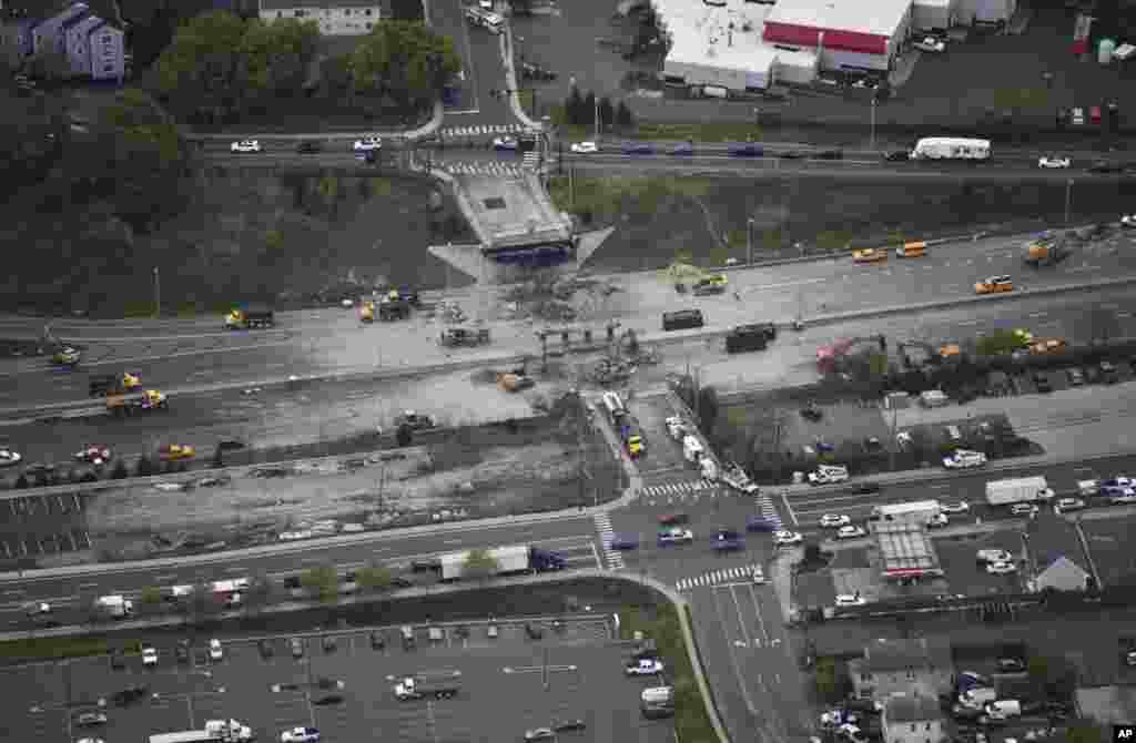This aerial view looking east shows demolition crews working to finish removing the Fairfield Avenue bridge over Interstate 95, May 4, 2024 in Norwalk, Connecticut. The tanker truck burst into flames under the overpass after colliding with two other vehicles.