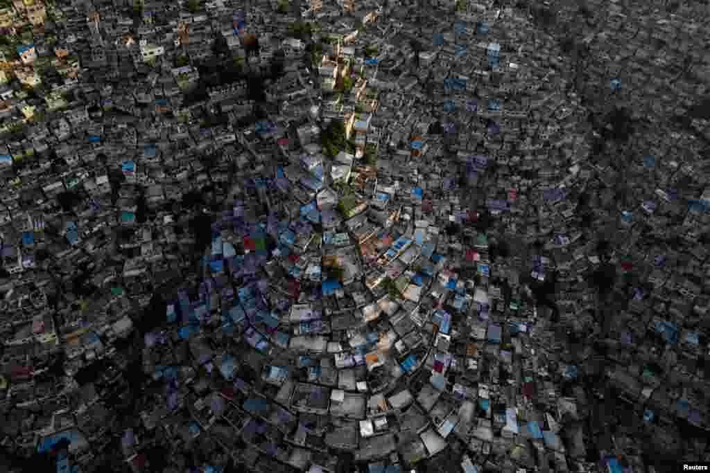 A drone view shows the sun setting over the Jalousie neighborhood, following the arrival of the first contingent of Kenyan police as part of a peacekeeping mission in the Caribbean country, in Port-au-Prince, Haiti, June 30, 2024. 