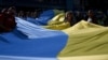 Members of the Ukrainian diaspora unfurl a 100-metre Ukrainian flag to mark the Independence Day of Ukraine in Katowice, Silesian region, on Aug. 24, 2024. 