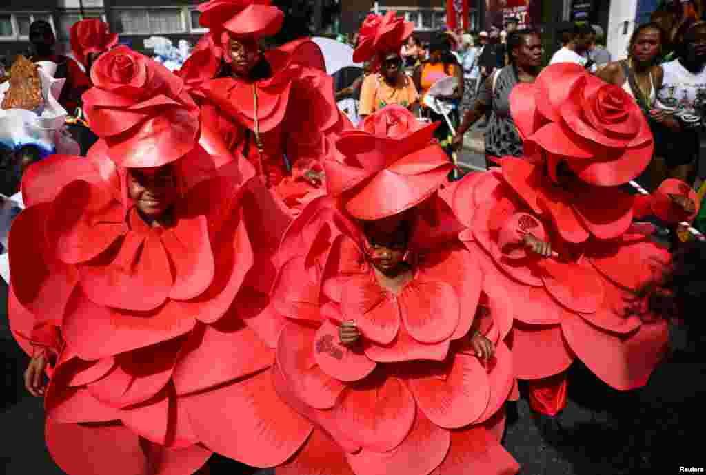 Revelers take part in the Children&#39;s Parade at Notting Hill Carnival in London.