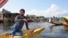 Boatman Imran Dar waits for tourists at the scenic Dal Lake in the summer capital, Srinagar, but says he hardly had any work this year. (A. Pasricha/VOA)