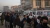 FILE - People queue to enter the passport office at a checkpoint in Kabul on Dec. 19, 2021, after Afghanistan's Taliban authorities said they would resume issuing passports.