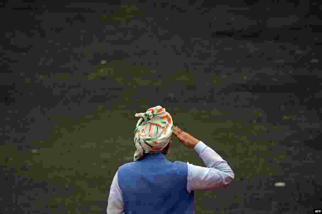 India's Prime Minister Narendra Modi inspects a guard of honor before addressing the nation from the ramparts of the Red Fort during the celebrations to mark countrys Independence Day in New Delhi.
