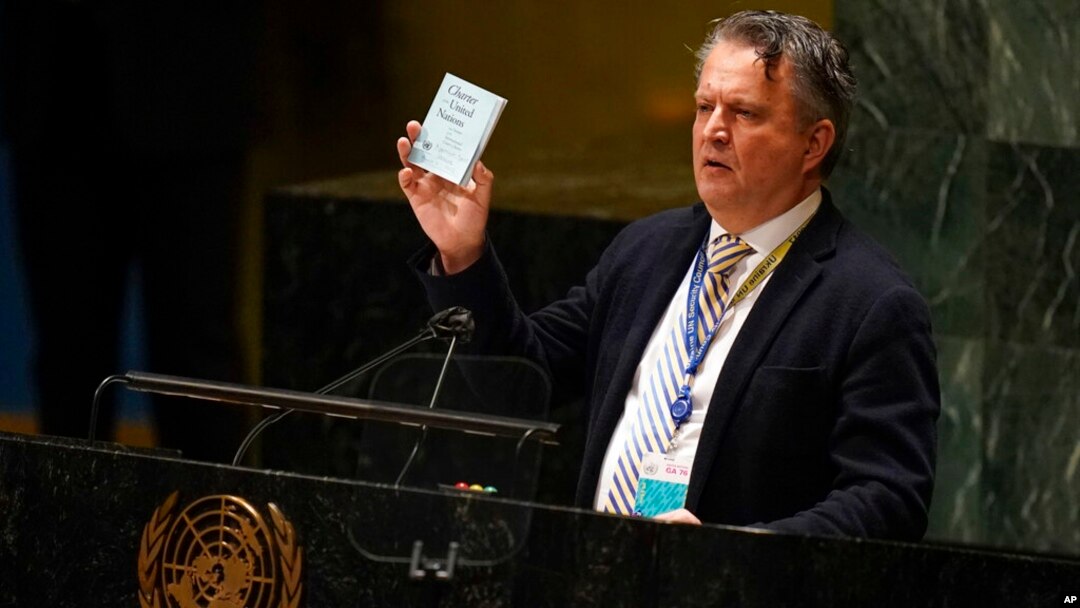 Ukrainian Ambassador to the United Nations Sergiy Kyslytsya holds up a copy of the charter of the United Nations while speaking during an emergency meeting of the General Assembly at United Nations headquarters, March 2, 2022.