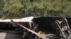 Déraillement d'une locomotive nouvellement au tournant d'un virage dans une zone marécageuse du sud-est de la RDC, en avril 2014. Cet accident du trin avait fait une centaine de morts. (Photo AFP/ NUMBI MATHYS)