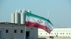 Bendera Iran di pembangkit listrik tenaga nuklir Bushehr Iran. (Foto: AFP)