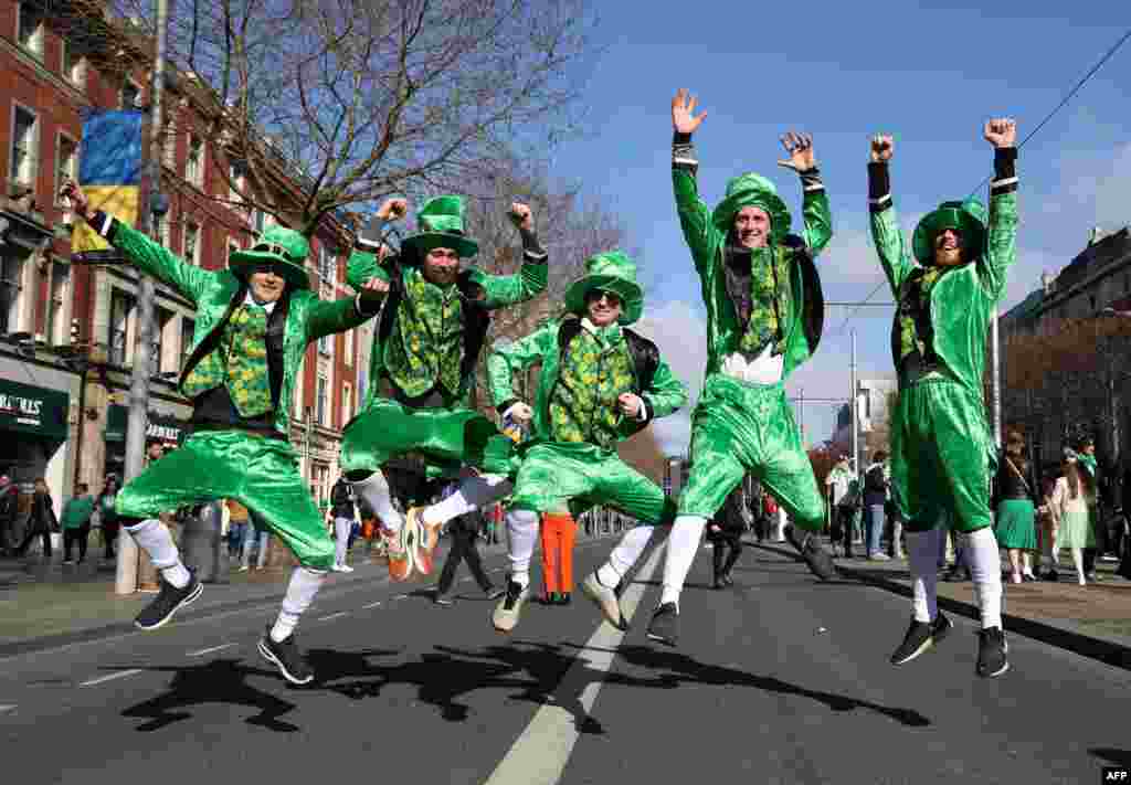 Revelers from Denmark dressed in green pose for a photo during the the annual St. Patrick&#39;s Day parade in Dublin, Ireland.