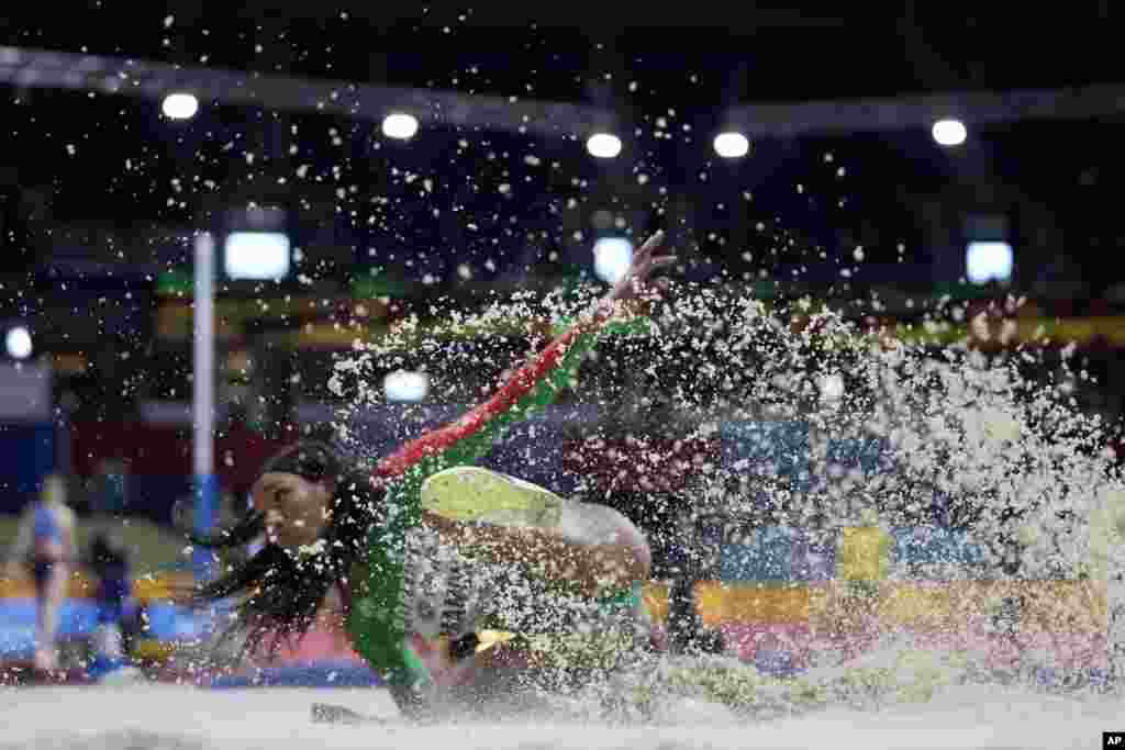 PatriCia Mamona of Portugal lands an attempt in the Women&#39;s triple jump at the World Athletics Indoor Championships in Belgrade, Serbia.