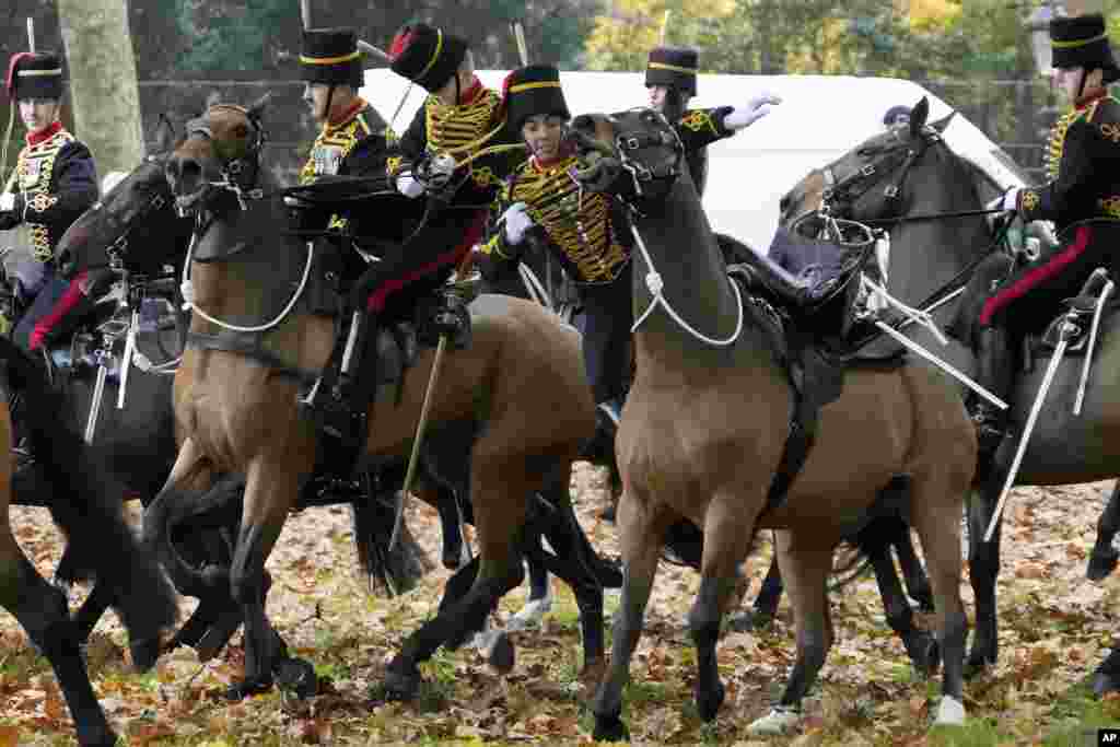 A soldier falls off a horse as the King&#39;s Troop Royal Horse Artillery arrive at Green Park to fire a 41 Gun Royal Salute to mark the 74th birthday of King Charles III in London.