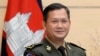 រូបឯកសារ៖ លោក ហ៊ុន ម៉ាណែត នៅពេល​លោក​ជា​ឧត្តមសេនីយ៍​ឯក​ផ្កាយ​៣ ឈរ​ថតរូប​នៅ​មុន​ជំនួប​របស់​លោក​ជាមួយ​នឹង​សមភាគី​ជប៉ុន​នៅ​ទីក្រុង​តូក្យូ ប្រទេស​ជប៉ុន ថ្ងៃទី១៦ ខែកុម្ភៈ ឆ្នាំ២០២២។ (Franck Robichon/Pool Photo via AP)