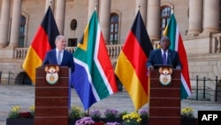 Kansela wa Ujerumani Olaf Scholz na rais wa Afrika Kusini Cyril Ramaphosa, wakiendesha mkutano wa pamoja na waandishi wa habari mjini Pretoria, May 24, 2022. Picha ya AFP