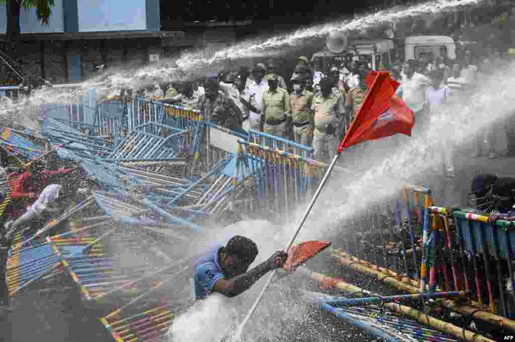 Police use a water canon to disperse activists of the Akhil Bharatiya Vidyarthi Parishad (ABVP), the students wing of the Bharatiya Janata Party (BJP), during a protest against West Bengal&#39;s state government over alleged irregularities in the Staff Selection Commission recruitment process, in Kolkata, India.