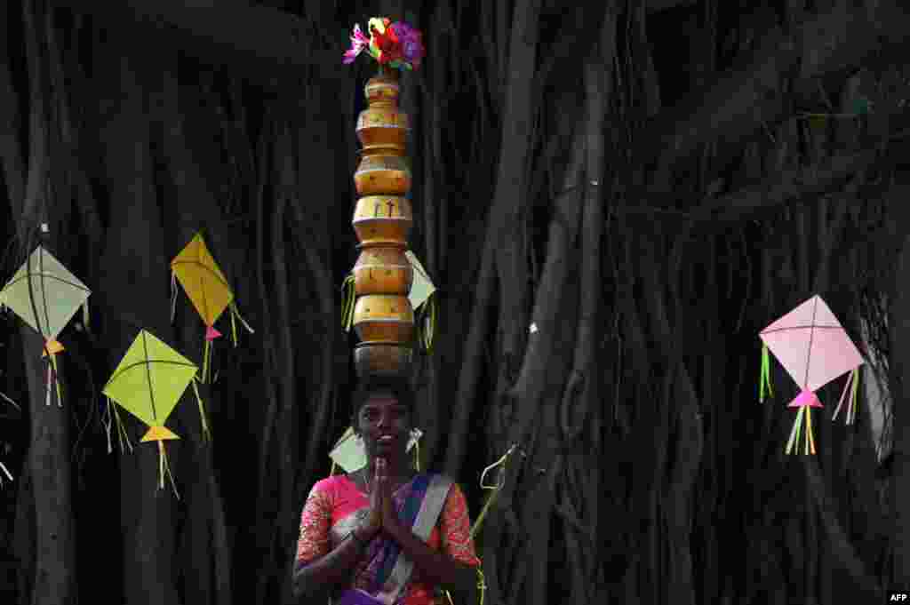 A students performs a Karagattam folk dance during celebrations for &#39;Pongal&#39;, the Tamil harvest festival, at a college in Chennai, India.