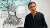 FILE - Allan Au, a veteran journalist and teaching consultant who has worked for a number of Hong Kong media outlets, speaks during a TV program in Hong Kong, Dec. 14, 2021. 