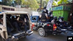 Lapolis fe patwouy apre yo finn rekipere kadav jounalis ki mouri anba bal Potoprens, Vandredi 7 Janvye 2022.