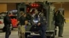 Armed police officers transport an injured man in an armored vehicle to a hospital Milwaukee, Aug. 14, 2016. 