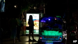 Sex workers stand in a largely shut-down red light area in Bangkok, Thailand, Thursday, March 26, 2020. A month-long state of emergency has been enforced in Thailand to allow its government to impose stricter measures to control the coronavirus that…