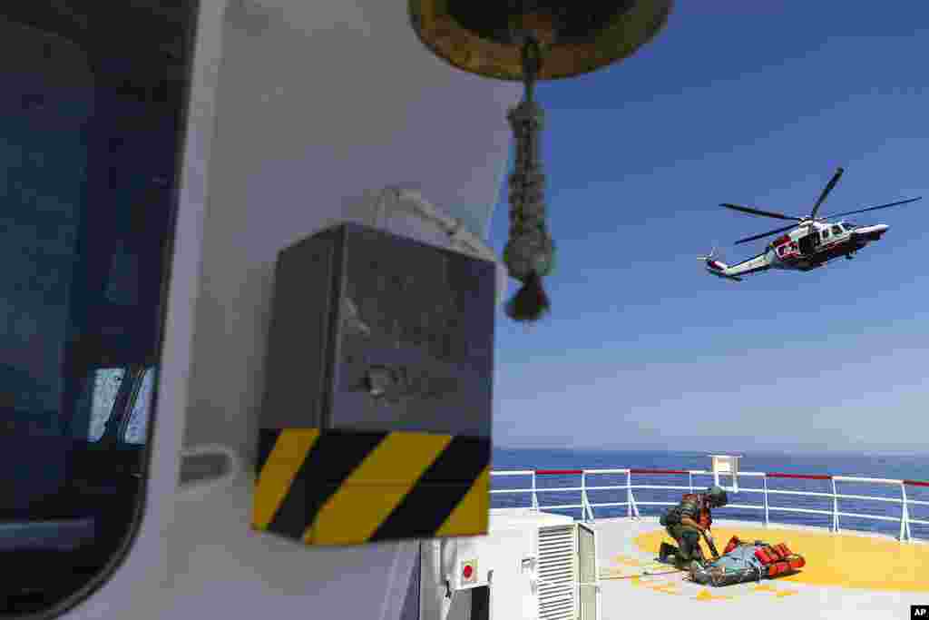 A pregnant woman from&nbsp;Tunisia,&nbsp;whose pregnancy is at high risk,&nbsp;is prepared to be evacuated&nbsp;by an Italian coast guard helicopter&nbsp;from the Ocean Viking,&nbsp;a migrant search and rescue ship, off Italian coasts.&nbsp;Her husband, daughter, 7, and son, 2, were left behind on the ship. Some 459 migrants have been waiting eight days for the Italian government to allocate a port to disembark.