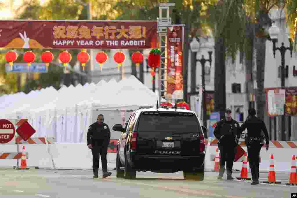 Police officers stand outside a ballroom dance club in Monterey Park, California.&nbsp;A gunman killed 10 people at a ballroom dance studio amid Lunar New Year celebrations and then may have tried &mdash; but failed &mdash; to target a second dance hall, authorities said.&nbsp;