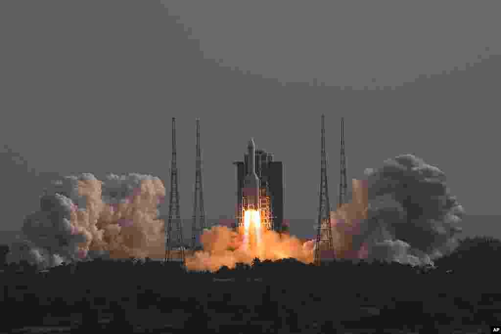 In this photo released by Xinhua News Agency, the Long March-5B Y4 carrier rocket carrying the space lab module Mengtian, blasts off from the Wenchang Satellite Launch Center in south China&#39;s Hainan Province. China has launched the third and final module to complete its permanent space station, realizing a more than decade-long endeavor to maintain a constant crewed presence in orbit.