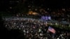 FILE - Anti-government demonstrators march in protest against the invocation of the emergency laws in Hong Kong, China, Oct. 14, 2019. 