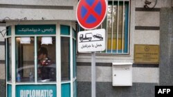 FILE - A policeman guards the entrance of the Azerbaijan embassy in Tehran on Jan. 27, 2023, following an attack.