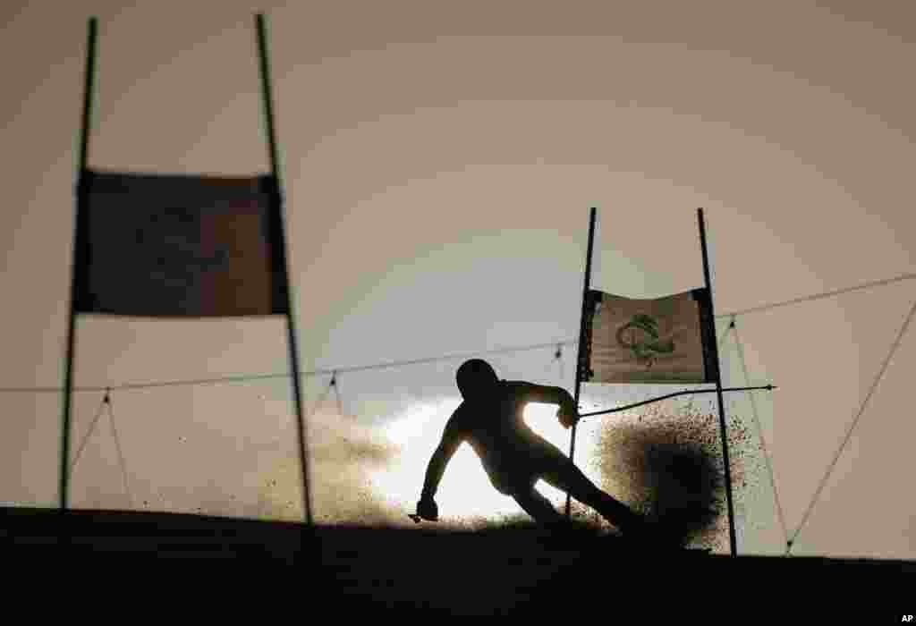 Jeffrey Stuut of the Netherlands (LW3) is seen silhouetted as he competes in the men&#39;s Giant Slalom Standing Para Alpine Skiing event at the Yanqing National Alpine Skiing Center during the Beijing Winter Paralympic Games in Yanqing, China.