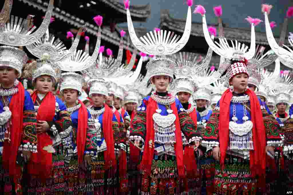 Women of the Miao ethnic minority, dressed in traditional costumes, take part in the celebration of the Kuzang Festival in Leishan county, in China&#39;s southwestern Guizhou province, Nov. 19, 2022.
