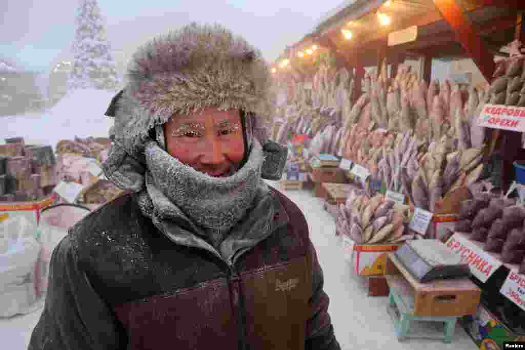 Vendor Yegor Dyachkovsky, 45, poses for a picture at an open-air market on a frosty day in Yakutsk, Russia. Yakutsk, one of the Russia&#39;s north-most cities, is hit by an extreme cold snap as the air temperature plunged as low as - 51&deg;&nbsp;C (- 59.8&deg; F).&nbsp;