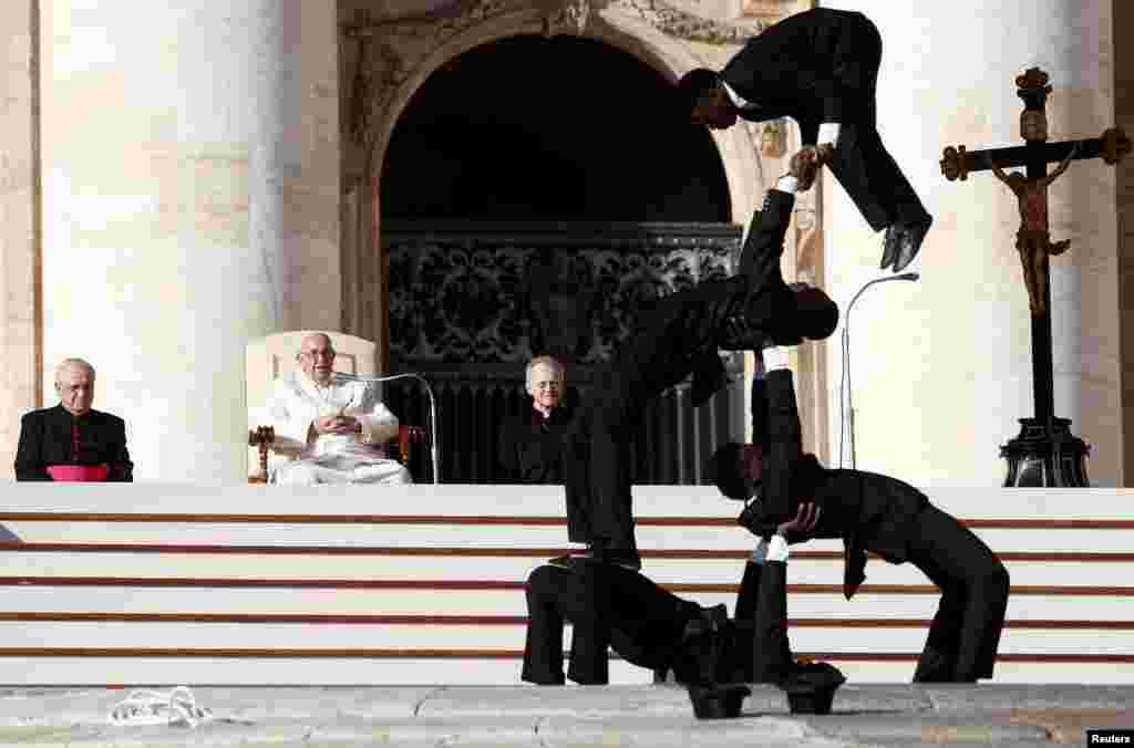 Circus members from Kenya perform during the weekly general audience held by Pope Francis in St. Peter&#39;s Square at the Vatican.