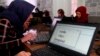 Young female Afghan coders practice at a Code to Inspire computer training center in Herat province, western Afghanistan, Jan. 21, 2018. The NGO had to renew its registration under the new Taliban regime to reopen the school.